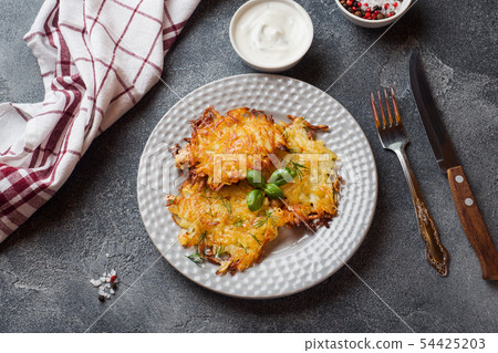Fried cakes of grated potatoes on the plate 54425203