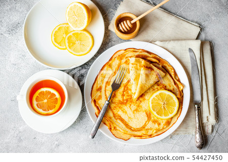 Tasty beautiful pancakes with banana and honey  54427450