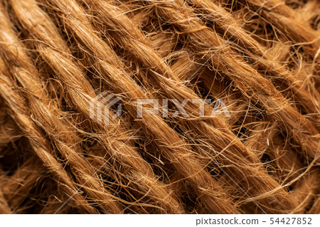 Skein of twisted yellow rope close up Skein of twisted yellow rope close up 54427852
