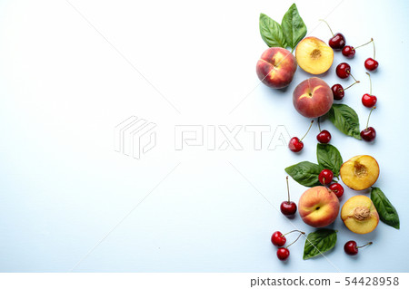 Layout of ripe sweet cherries and peaches Layout of ripe sweet cherries and peaches 54428958