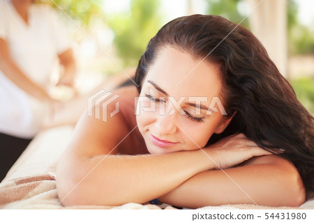 Spa. Woman getting spa lastone therapy outdoor. Spa. Woman getting spa lastone therapy outdoor. 54431980