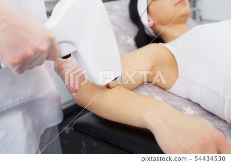 Laser hair removal in professional beauty studio 54434530