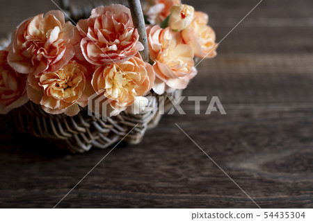 Orange carnation wood grain background 54435304