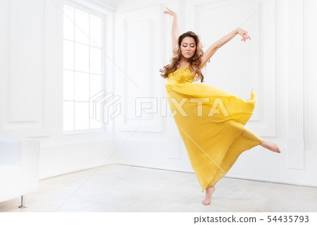 Contemporary dancer in yellow dress 54435793