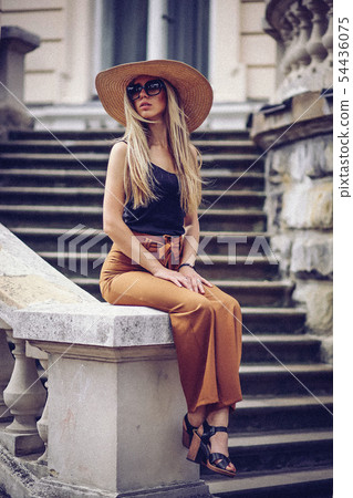 Noise. Vintage Style. Portrait of beautiful cool girl gesturing in hat and sunglasses over grunge Noise. Vintage Style. Portrait of beautiful cool girl gesturing in hat and sunglasses over grunge 54436075