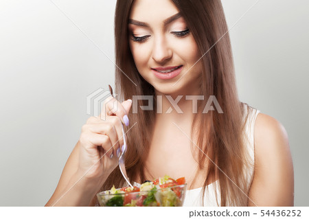 Diet. Healthy food. Weight loss and subtle body concepts. Fitness girl who has a bowl of salad Diet. Healthy food. Weight loss and subtle body concepts. Fitness girl who has a bowl of salad 54436252