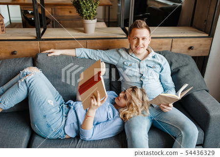 Love couple resting on comfortable couch at home 54436329