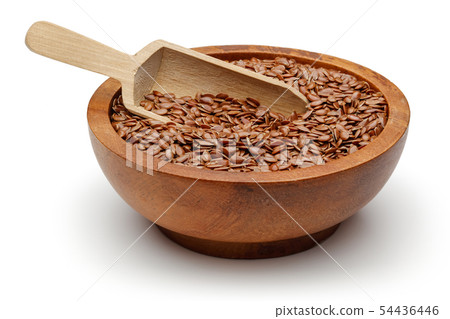 Flax seeds in wooden bowl isolated on white Flax seeds in wooden bowl isolated on white 54436446