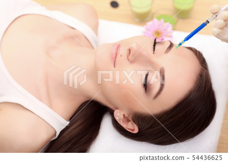 Beautiful woman gets injections. Cosmetology. Beauty Face Beautiful woman gets injections. Cosmetology. Beauty Face 54436625