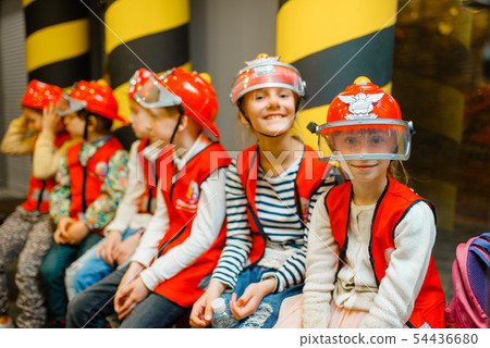 Children in helmets and uniform playing fireman 54436680
