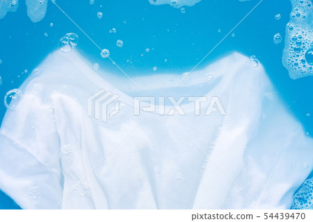 White T - shirt soak in powder detergent water 54439470