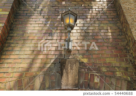 Brick wall with outside light 54440688