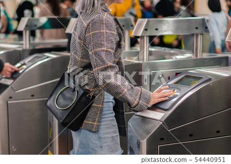 People use ticket touch and pay at entrance of People use ticket touch and pay at entrance of 54440951