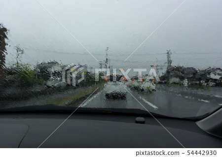 Driving on a rainy day Poor visibility Rainy car window Front glass Driving on a rainy day Poor visibility Rainy car window Front glass 54442930