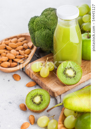 Glass bottle of fresh smoothie juice organic green Glass bottle of fresh smoothie juice organic green 54445127