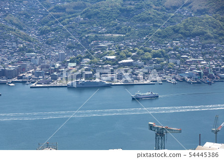 Ferry entering the port with a passenger boat at Matsugae Pier 54445386