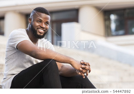 Portrait of african guy student waiting for lessons Portrait of african guy student waiting for lessons 54447892