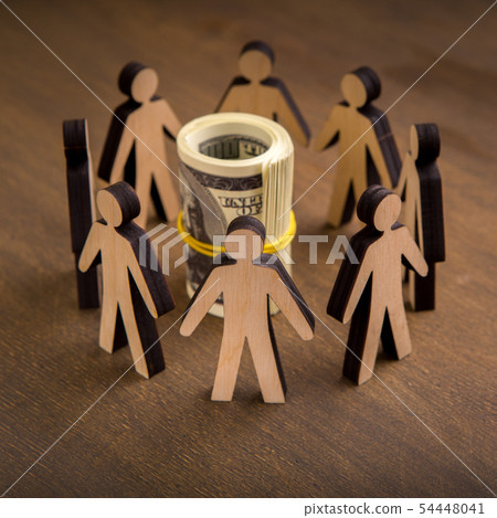 Close up of wooden human collaboration around money Close up of wooden human collaboration around money 54448041