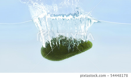Ripe avocado sinking into water with bubbles Ripe avocado sinking into water with bubbles 54448178