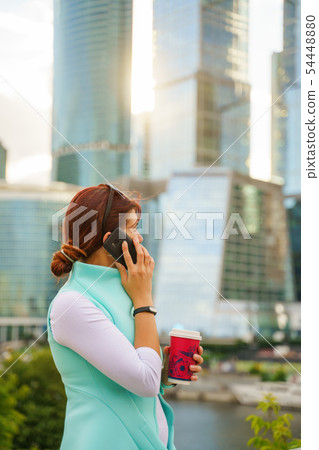 Portrait of a businesswoman talking on the phone Portrait of a businesswoman talking on the phone 54448880