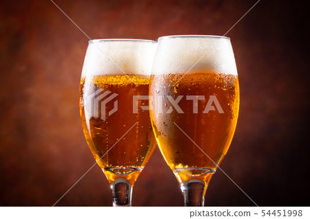 A toast with beer A toast with beer 54451998