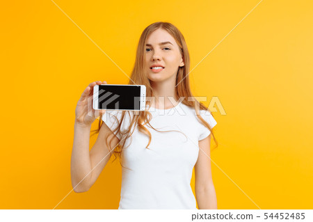 Portrait of a beautiful girl , showing a blank 54452485