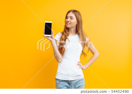 Portrait of a beautiful girl , showing a blank Portrait of a beautiful girl , showing a blank 54452490