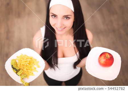 Choose between junk food versus healthy diet 54452782