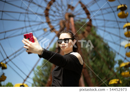 Girl taking selfie Girl taking selfie 54452973