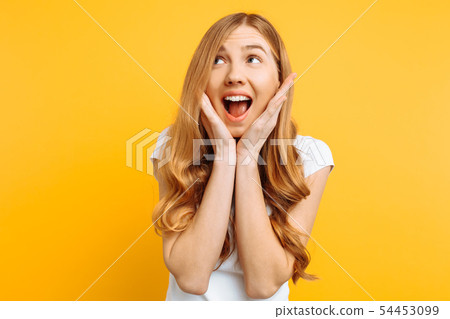 of an enthusiastic young girl screaming with joy 54453099