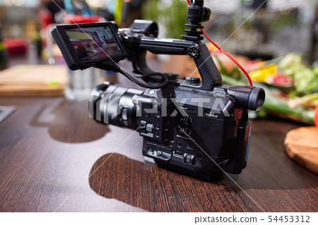 Behind the scenes of movie shooting or video production and film crew team with camera equipment at Behind the scenes of movie shooting or video production and film crew team with camera equipment at 54453312
