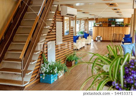 The interior of the urban river ship, with a panoramic view of the urban landscape. The concept of 54453371