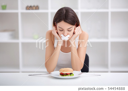 Diet. Unhealthy eating. Junk food concept. Girl don't eat junk food Diet. Unhealthy eating. Junk food concept. Girl don't eat junk food 54454888