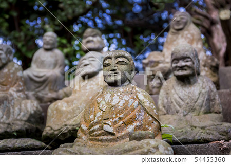 Stone figures of Japanese Buddhist monks close-up. Stone figures of Japanese Buddhist monks close-up. 54455360