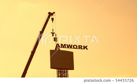 Workers and cranes are installing billboards. 54455726