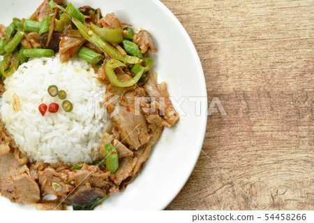 spicy stir fried duck meat curry on rice in plate 54458266
