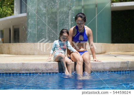 Asian chinese mother teaching child to swim Asian chinese mother teaching child to swim 54459024