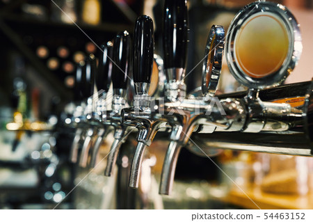 Beer taps in row. 54463152
