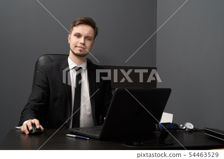 Man in smart suit posing while working with lie detector Man in smart suit posing while working with lie detector 54463529