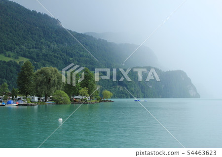 Rain arriving at Lake Brienz, Switzerland. 54463623