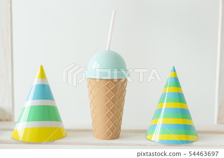 Striped colourful cones hats. Birthday holiday party concept. Striped colourful cones hats. Birthday holiday party concept. 54463697