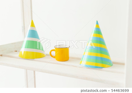 Striped colourful cones hats. Birthday holiday party concept. Striped colourful cones hats. Birthday holiday party concept. 54463699