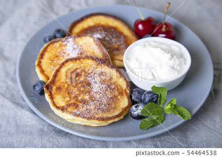 Cottage cheese pancakes (syrniki). Cottage cheese pancakes (syrniki). 54464538