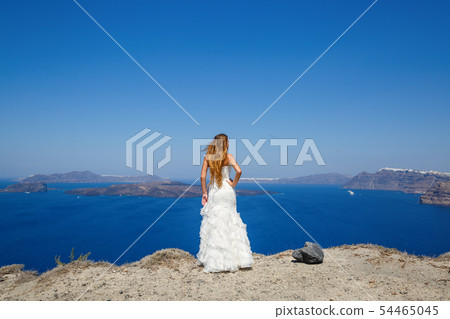 Beautiful woman in a white dress Beautiful woman in a white dress 54465045