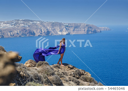 Beautiful woman in a blue dress Beautiful woman in a blue dress 54465046