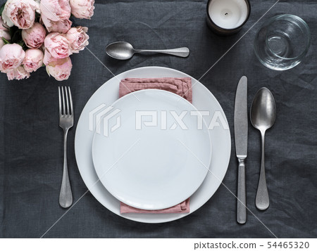 Beautiful table setting on gray linen tablecloth 54465320