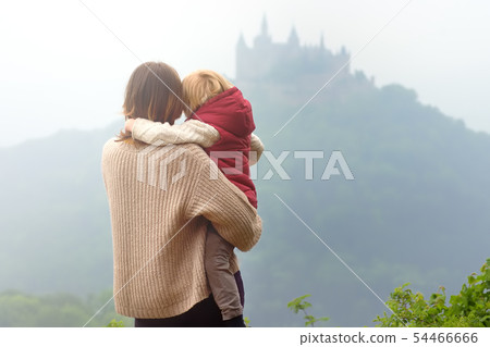 Young woman with little child admiring view of Young woman with little child admiring view of 54466666