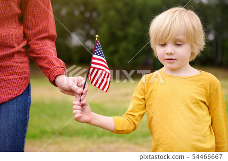 Young woman and little child holding american Young woman and little child holding american 54466667