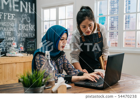 staff talking with friend client together staff talking with friend client together 54470238