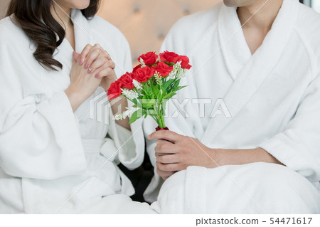 Gentle man giving a bouquet 54471617